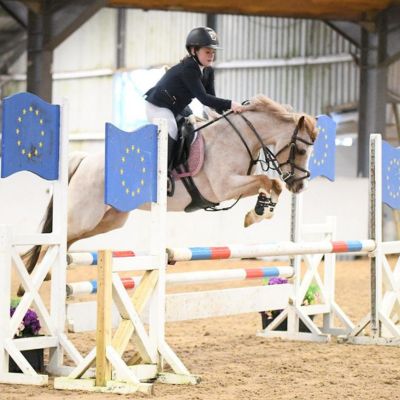 Pony in showjumping competition